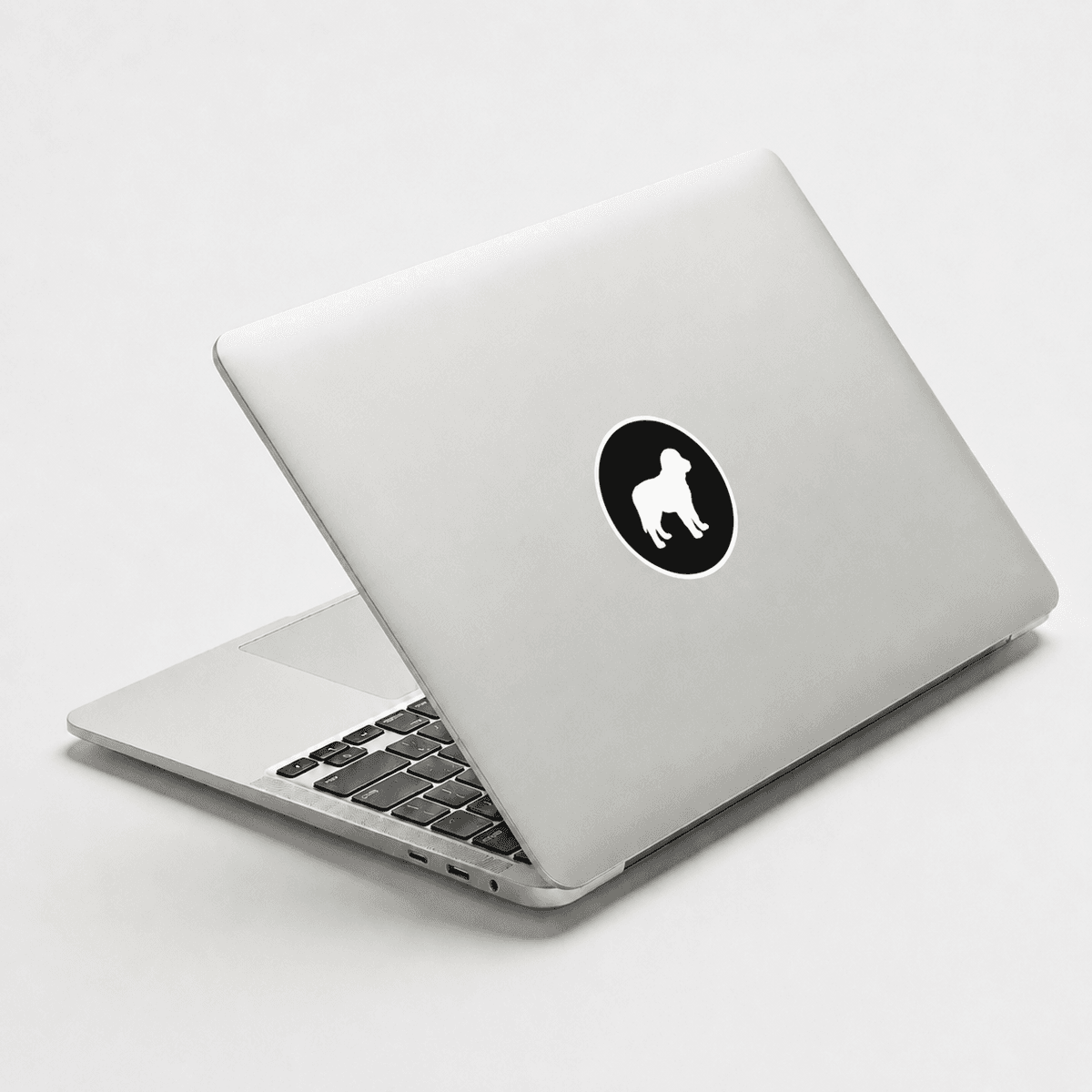 MacBook with Woofyful noir sticker